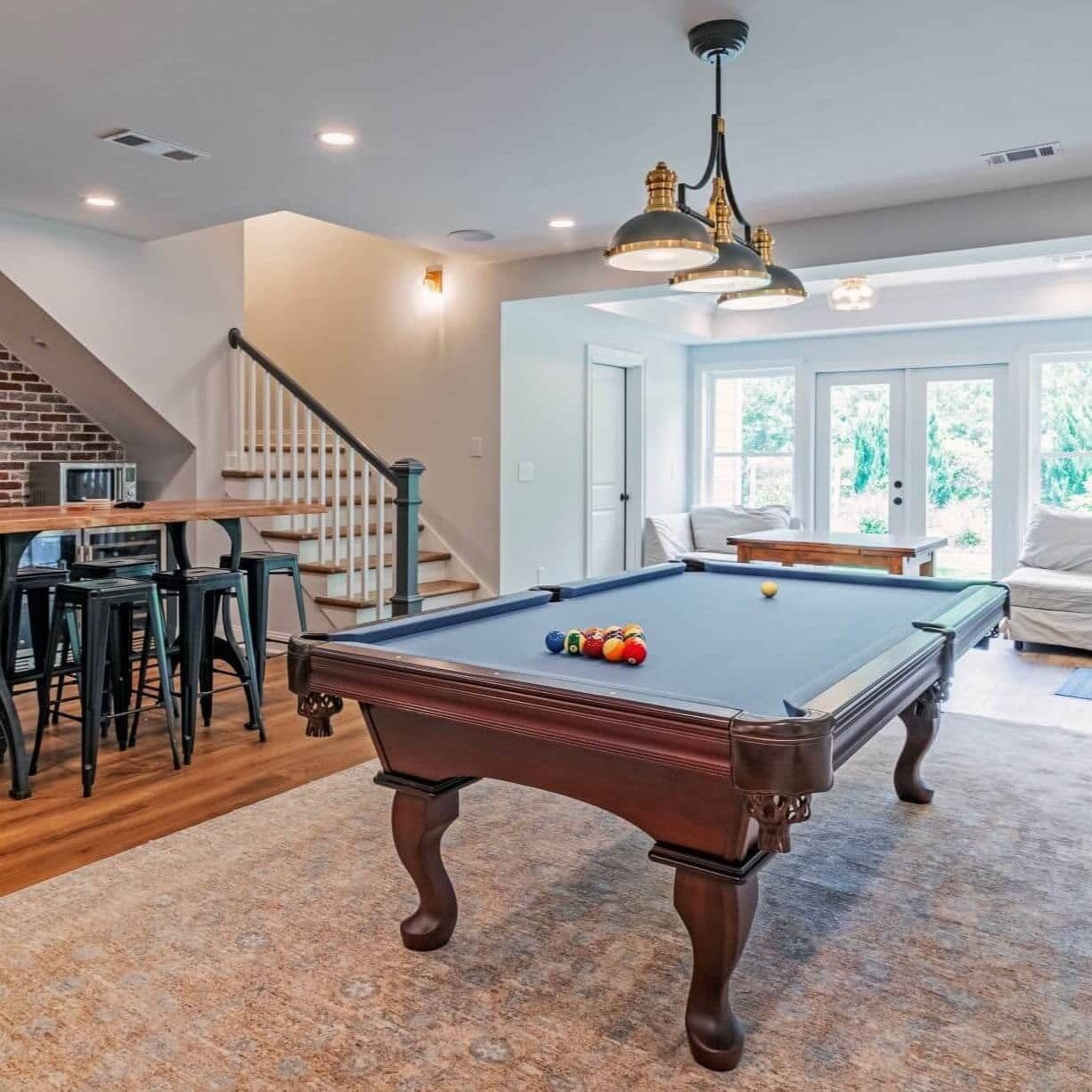 Basement recreation room with billiards and custom built-ins